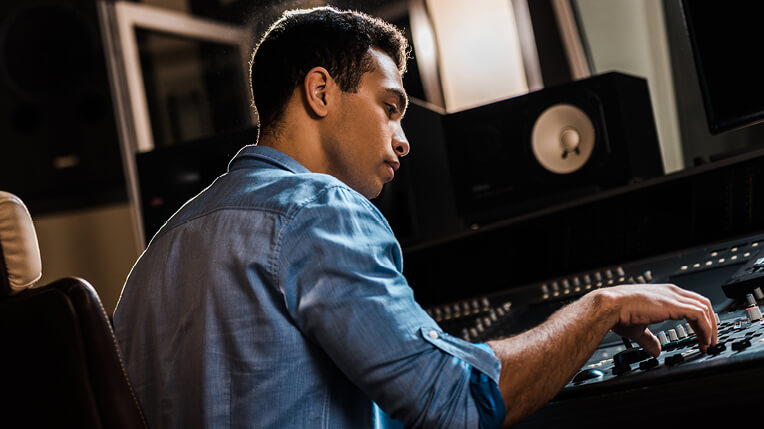 student using a hardware to control audio
